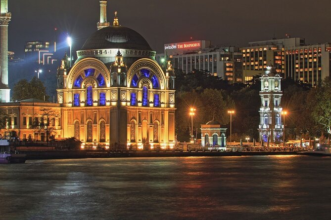 Bosphorus Night Lights: Guided Cruise With Tea and Cookies - Passing Dolmabahçe and Çırağan: Ottoman Grandeur in Night Lighting