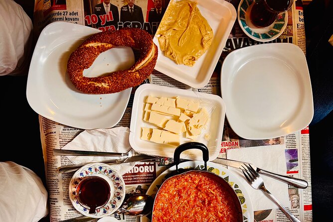 Istanbul Guided Street Food Tour Around European and Asian Sides - Eminönü breakfast stop: dairy cream, honey, cheeses, and warm street staples