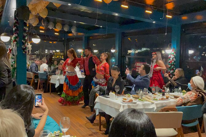 Istanbul New Year's Eve 2027 Dinner and Party Cruise on Bosphorus - Ortaköy under the Bosphorus Bridge: the party district view